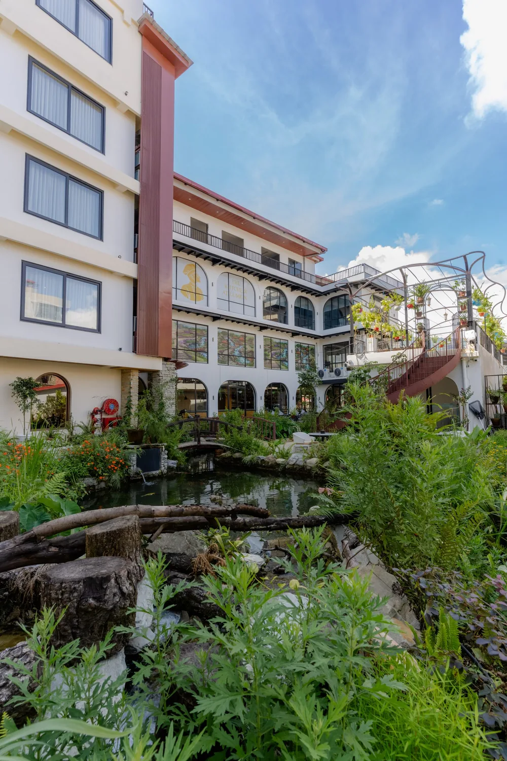 Hotel Lumen courtyard garden and koi pond seen from above