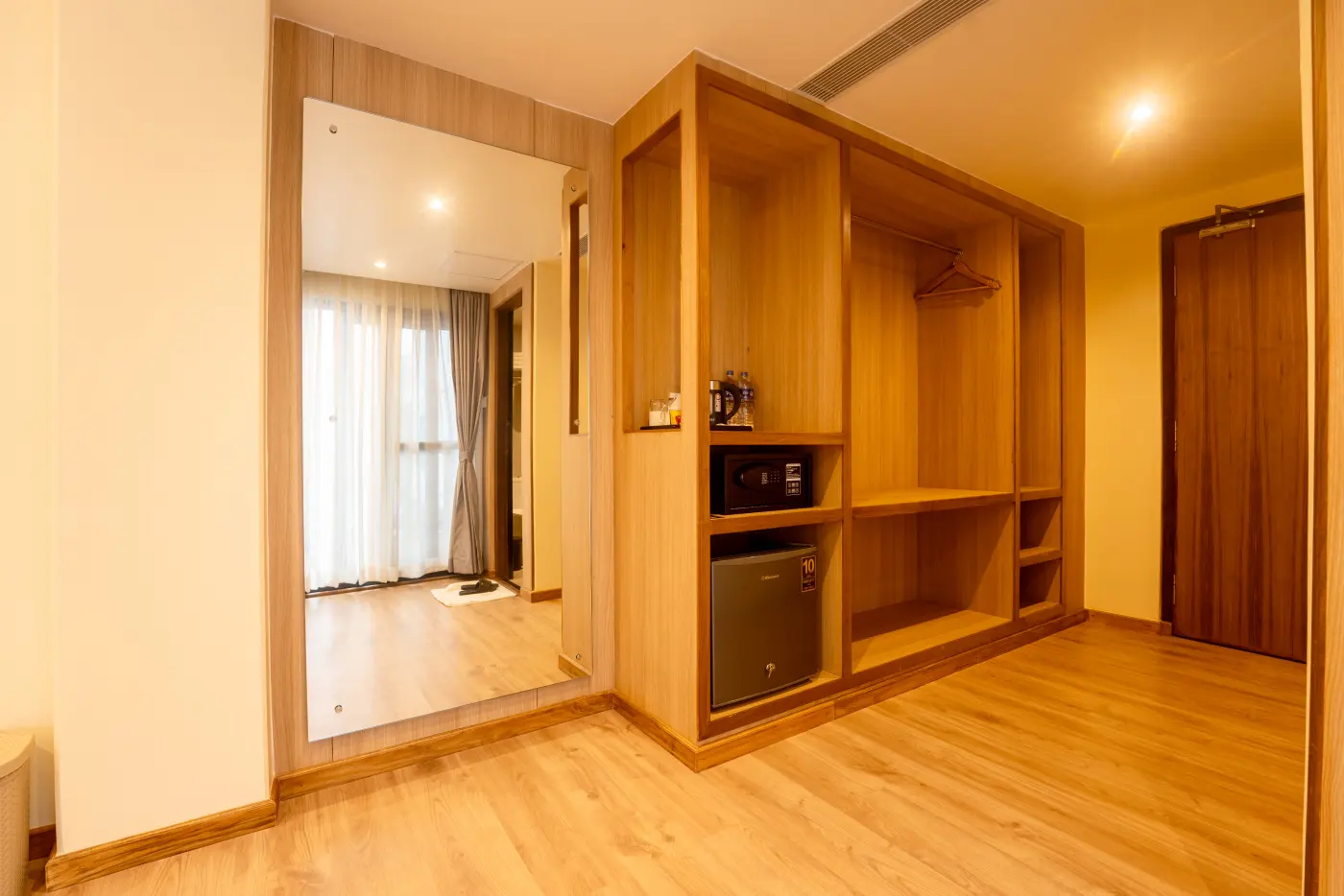 Hotel Lumen wardrobe, mirror, safe and mini-bar storage