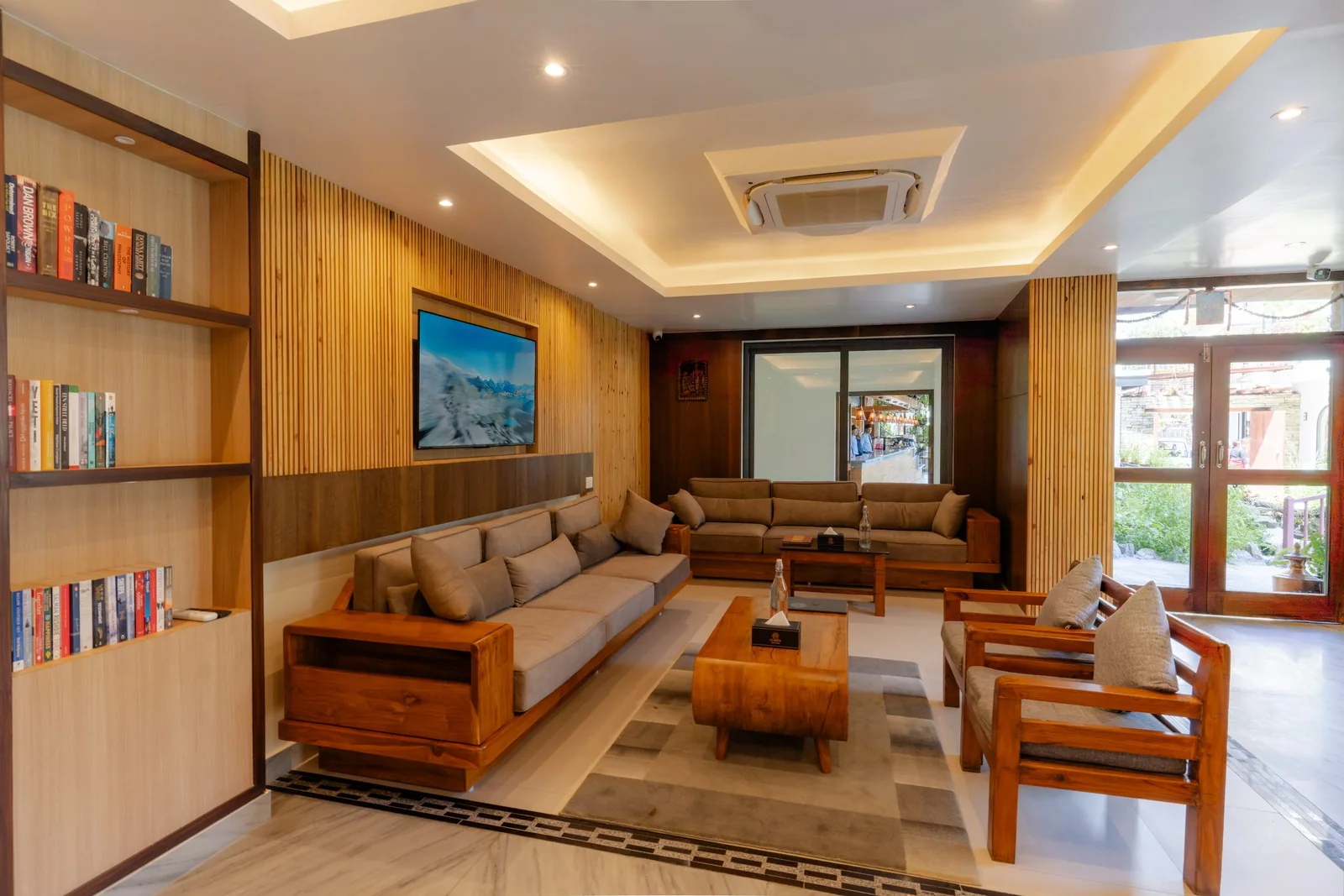 Bookshelves and wooden seating in the Hotel Lumen lounge