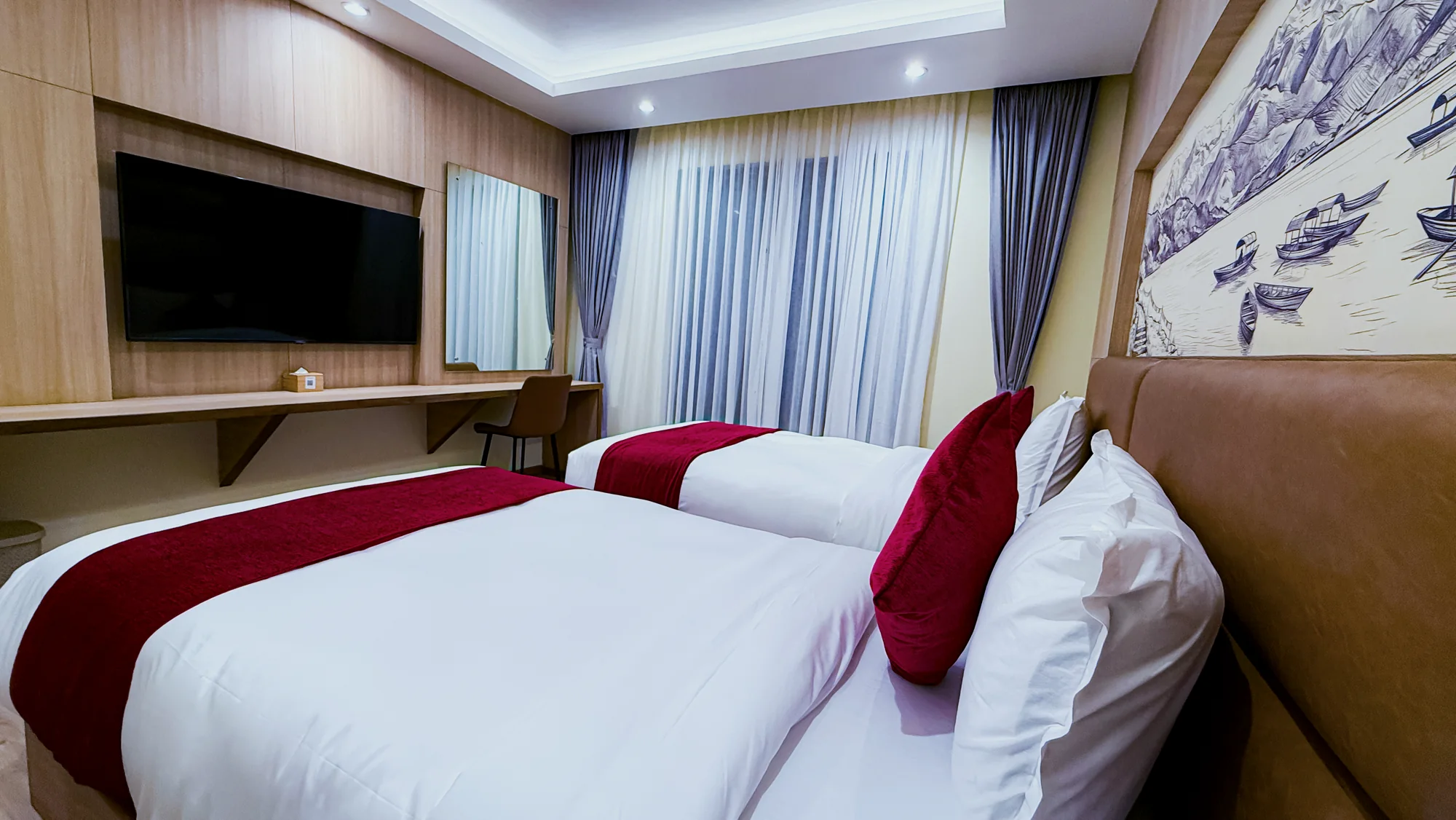 Freshly prepared beds in a Hotel Lumen room